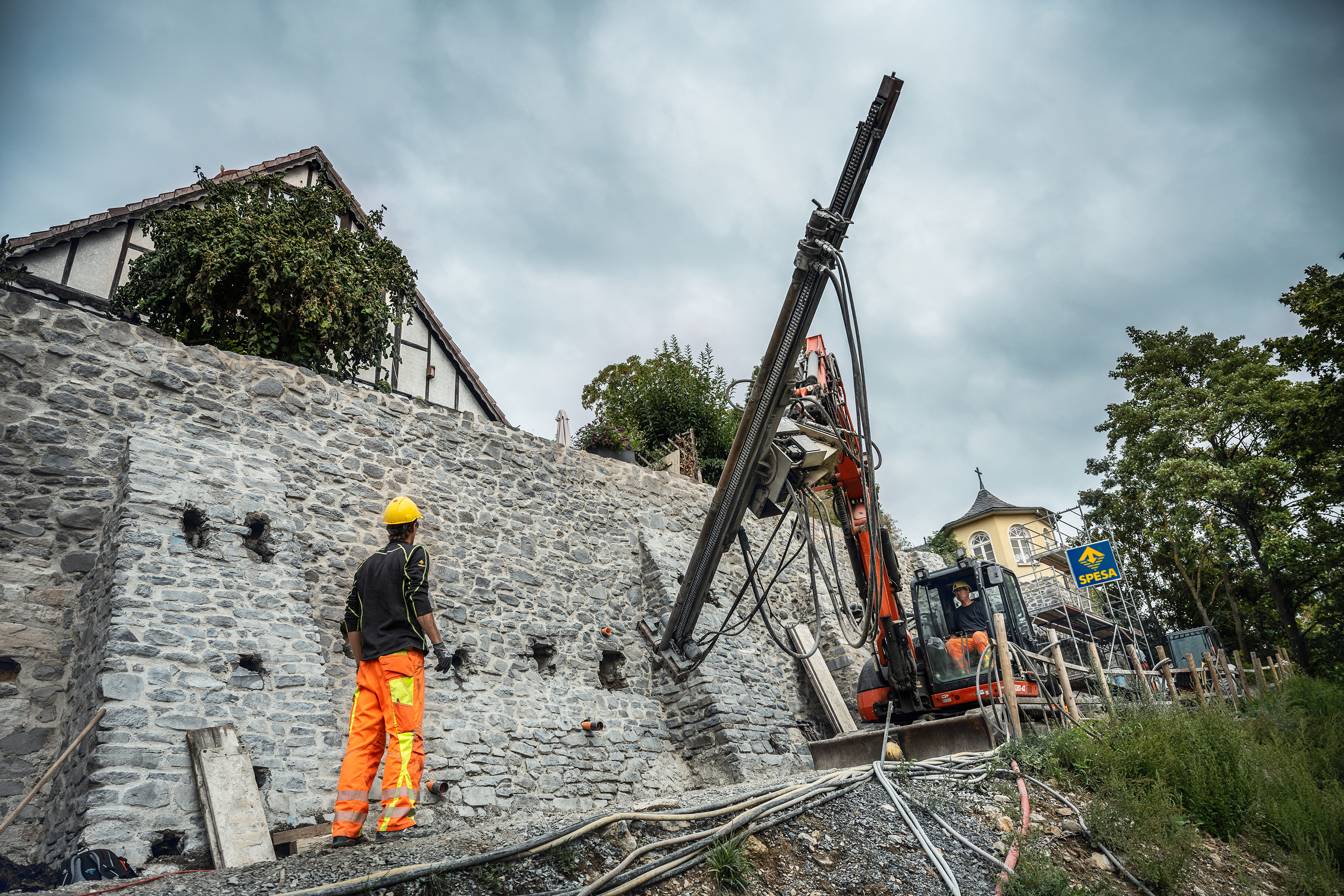 Injection boreholes and masonry nails were installed along with structural reinforcement using self-drilling anchors.