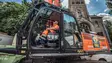 Bauer Resources employee demolished a residential building in Munich using a long reach excavator