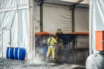 Bauer Resources employees in protective suits working with polluted soil in Elmshorn